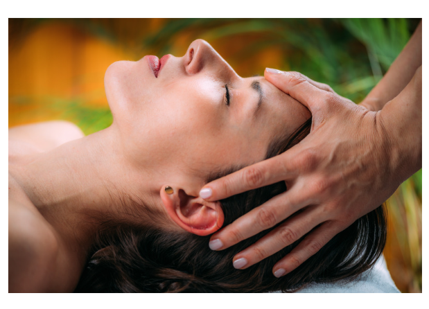 Woman receiving gentle craniosacral therapy